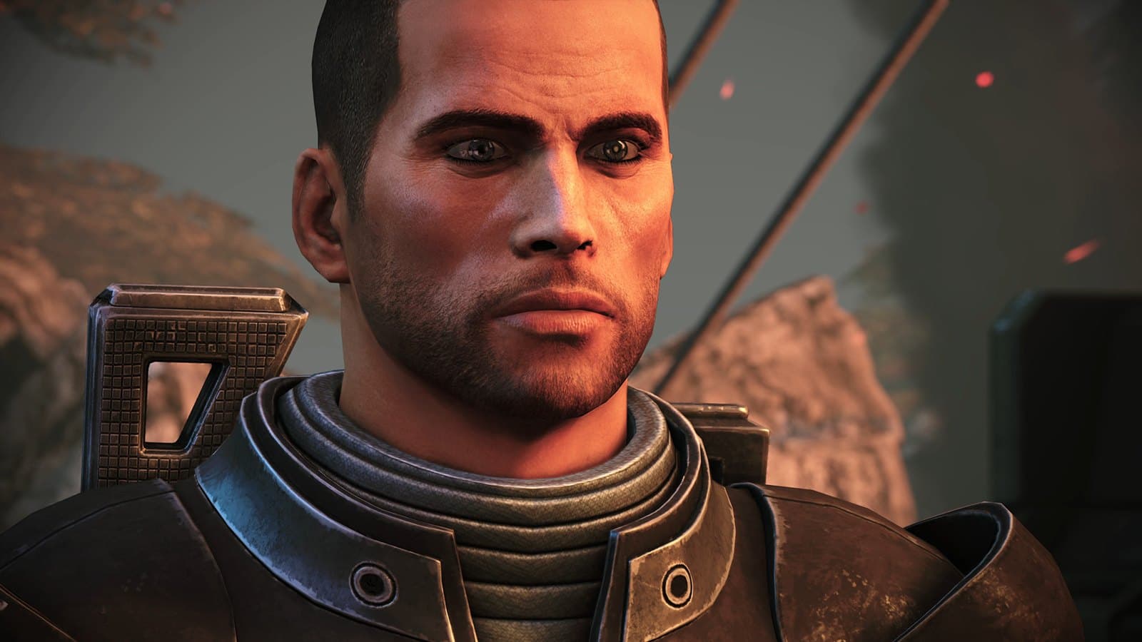 Close do comandante Shepard, de armadura, em cena de Mass Effect Legendary Edition