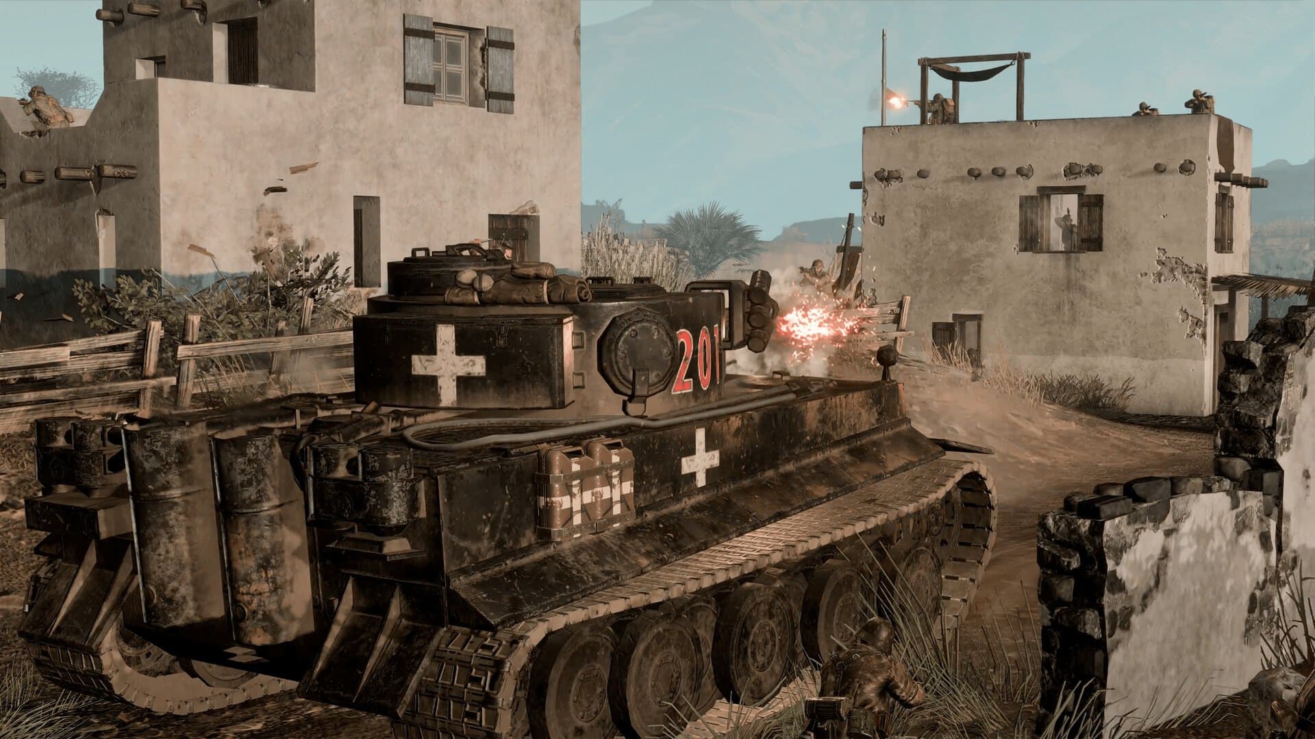 Um Tiger alemão avança entre casas de uma vila no Norte da África em Operation Torch.