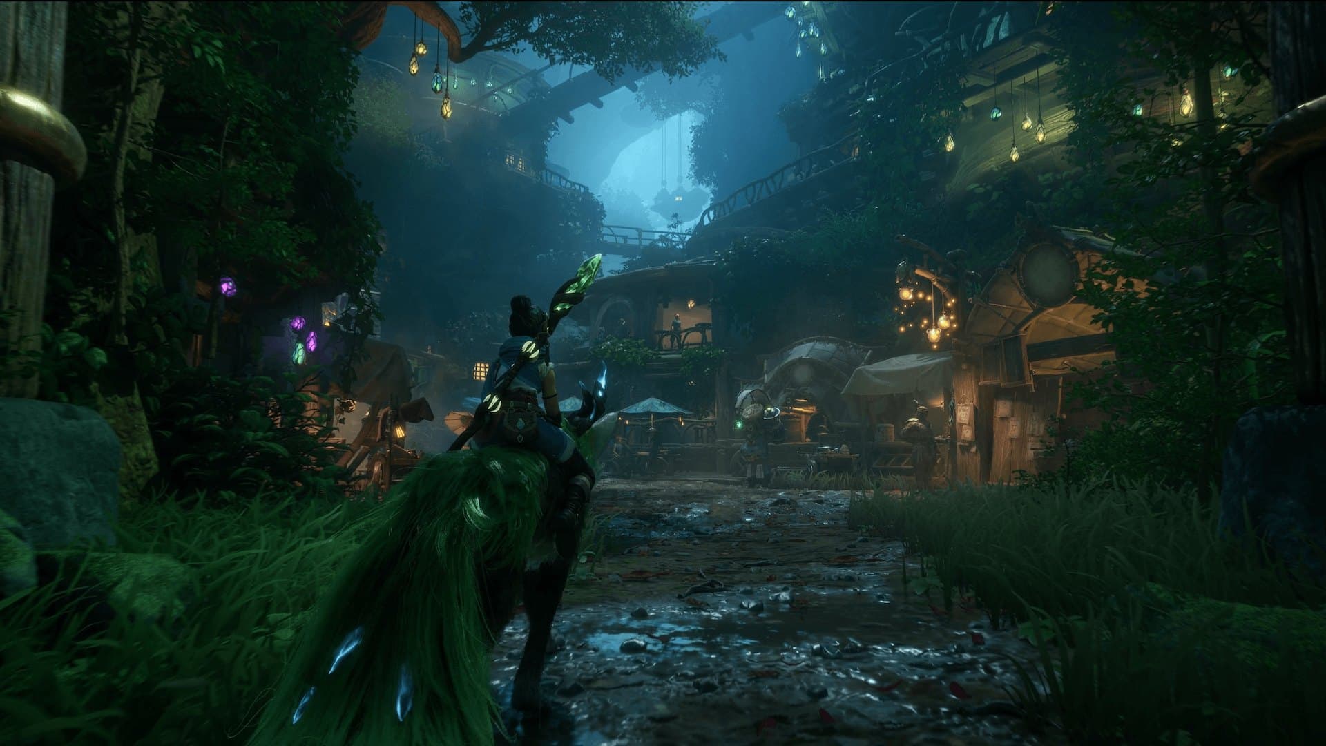 Kena caminha por uma vila iluminada na floresta em imagem oficial de Kena: Scars of Kosmora