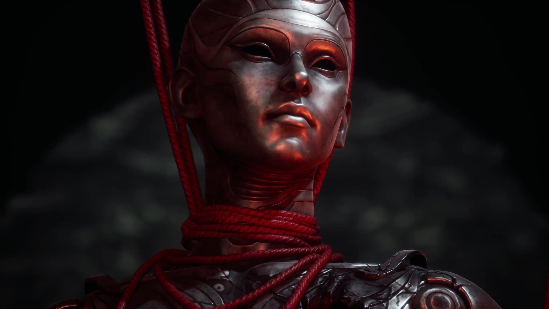 Uma figura de rosto metálico, presa por cordas vermelhas, no trailer de lançamento.
