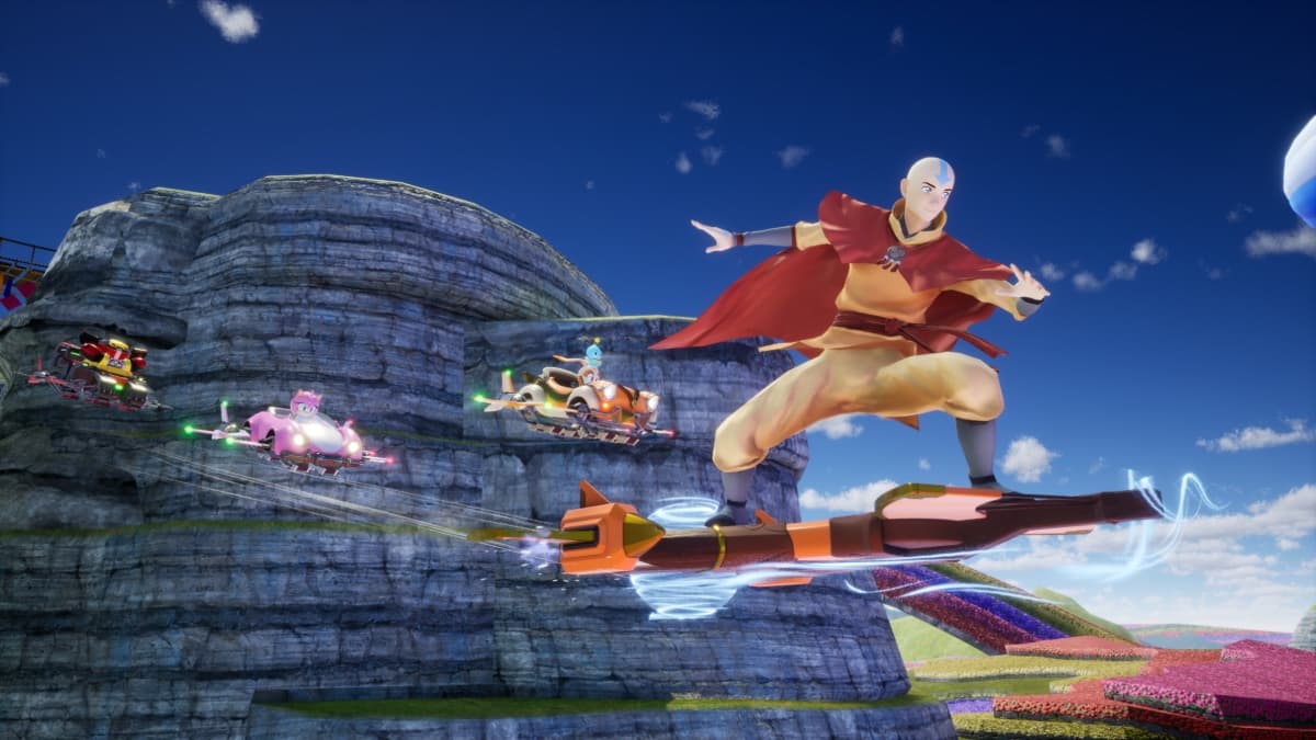Aang voa sobre um veículo na pista de Sonic Racing CrossWorlds com outros competidores ao fundo